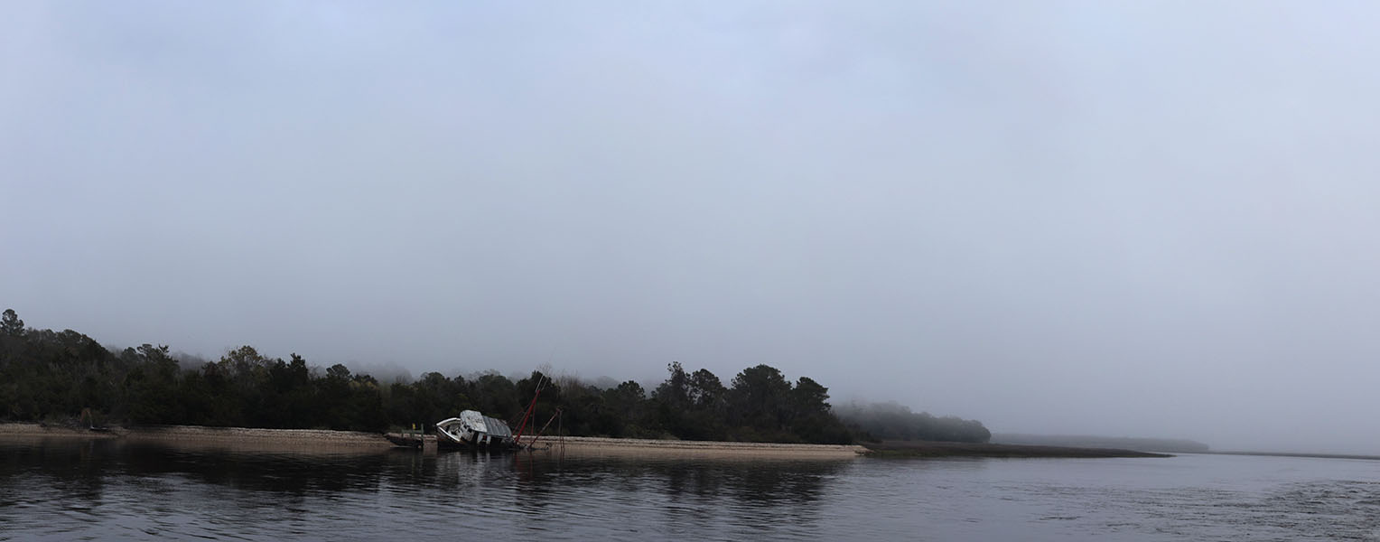 Foggy Coastline with Wrecked Fishing Boat